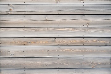 weathered barn wood planks, grey with knots