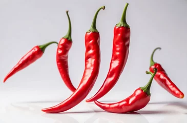 Fotobehang red hot chili peppers in white backgrounds © Johan Wahyudi