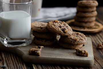Oatmeal cookies with pieces of chocolate. on a wooden background. snack