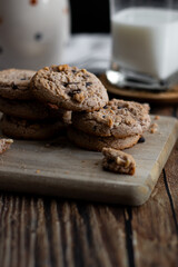 Oatmeal cookies with pieces of chocolate. on a wooden background. snack