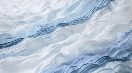 Obraz premium Abstract background with waves of white and blue fabric. 