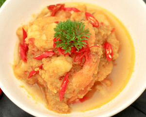 Selective focus. Udang Rica is a traditional Indonesian dish made with shrimp that is seasoned with a spicy chili sauce. It is made from a mixture of ground spices and herbs.
