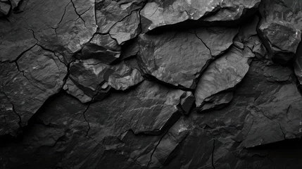 Fototapeten A textured black stone background crafted from the rough, dark grey surface of a mountain, complete with cracks and ample space for creative design © Matthew