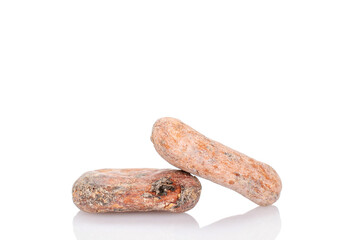 Two cocoa beans, macro, isolated on white background.