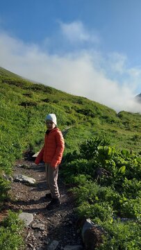 boy in the mountains on a hike, nature, sky, mountains