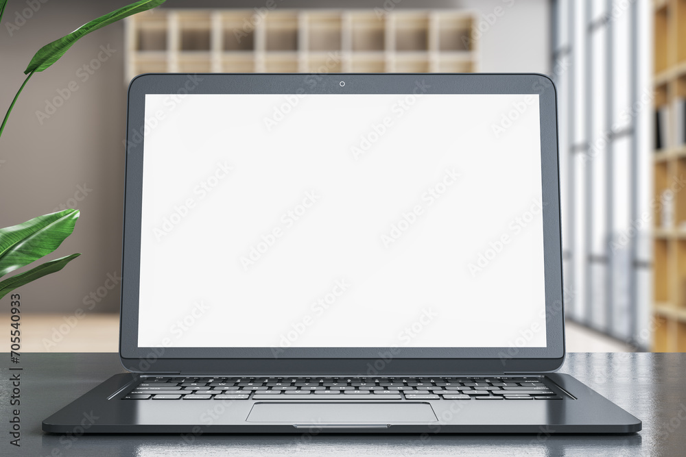 Poster contemporary designer office desk with empty white mock up laptop screen and other items on blurry o