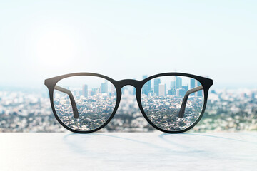 Spectacles with a clear view of the city, metaphor for focused vision and modern urban life