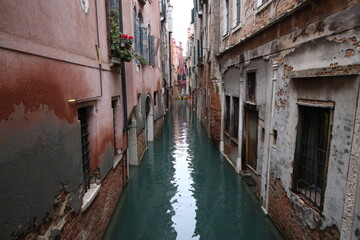 Picturesque canal between historical buildings in Venice