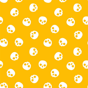 Yellow seamless pattern with white halloween skull
