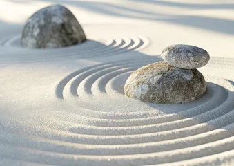 Fotobehang Round stones on the sand  © Olya Fedorova