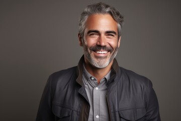 Portrait of a handsome middle-aged man smiling at camera.