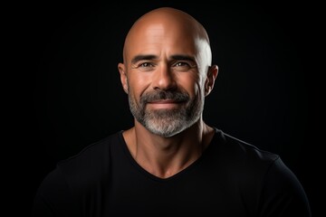 Obraz premium Portrait of a handsome middle-aged man on a dark background.