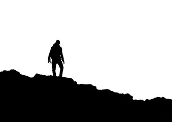 A silhouette of a wanders on top of the mountain - 705549558