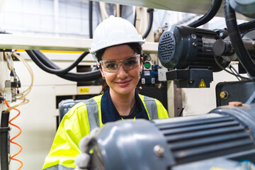 Portrait female professional engineer factory in protective uniform operating machine, Engineering worker in safety hardhat at warehouse industrial facilities, Heavy Industry Manufacturing - obrazy, fototapety, plakaty