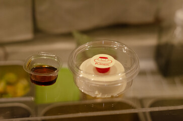 Kiwi cream pudding, Panna Cotta with kiwi sauce, on a plate. Light gray background 