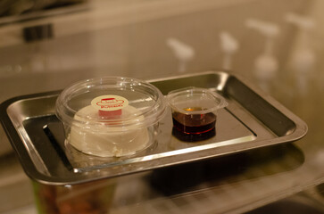 Kiwi cream pudding, Panna Cotta with kiwi sauce, on a plate. Light gray background 