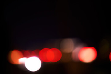 Night traffic bokeh. A Symphony of Red Bokeh Lights Dancing in the Dark Night. Illuminated Orbs of Light Creating a Mesmerizing Abstract Display.