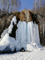 Ice waterfall, spring melting snow, natural object, frozen ice, tourist attraction.