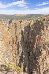 A steep precipice in front of the north rim of the Black Canyon of the Gunnison at Cross Fissures...