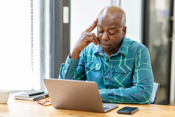 Business senior man 60 years old using laptop computer and thinking about question in office. Happy...
