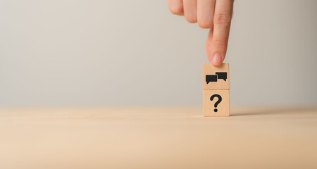 Q and A concept. Q and A symbols on wooden cube blocks on a grey background. Illustration for...
