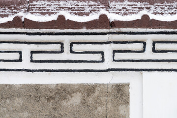 snow on the wall, snowflakes perched on the fence.