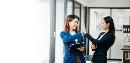 Fototapeta premium Business Show me the joy hi five hands With businesswomen executives celebrating the success of the company..