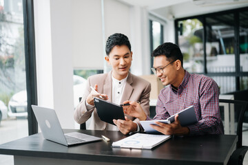 Portrait of success business people working together in office. Couple teamwork startup concept.