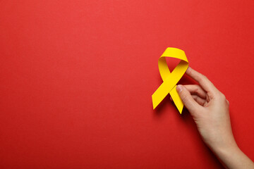 Yellow paper ribbon on a red background