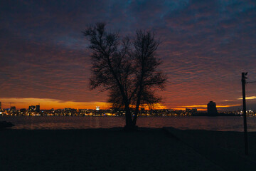 Panoramic view of the city of Dnipro during sunset or sunrise. Amazing sunset at Dnipro river with...