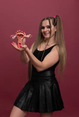 Naklejka premium woman holds model of female reproductive system in the hands. Help and care concept