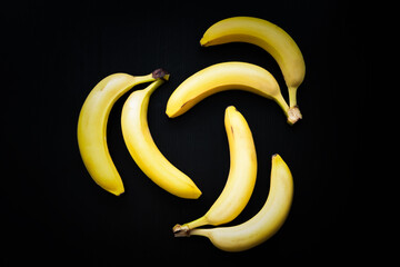 Three by two bananas on black background