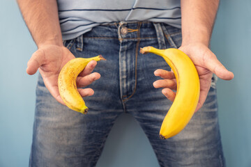 Small Banana compare size wish banana on blue background. Sexual life libido, penis size and...