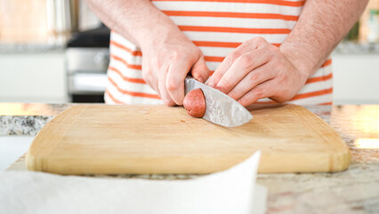 Young Man Enthusiastically Preparing Dinner in Modern Kitchen