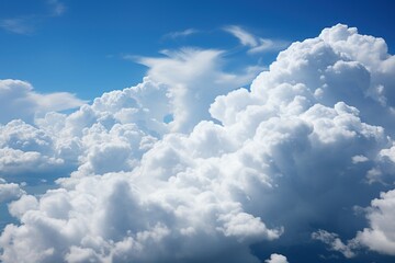 Naklejka na ściany i meble Billowing cumulus clouds against a blue sky
