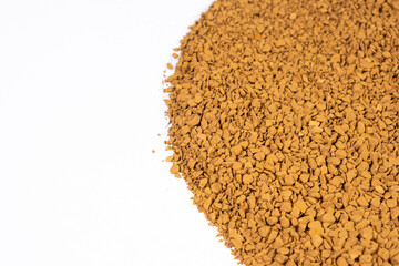 Background of freeze-dried granulated instant coffee macro close-up. Place for text on white