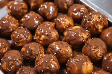 Baking traditional French dessert - Choux Pastry or profiterole pastry balls