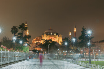 Fototapeta na wymiar Hagia Sophia or Ayasofya Mosque view with motion blur of the people at night