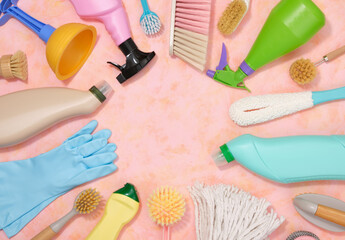 Top view of brushes, rags, cleaners and detergents for cleaning. Cleaning products and household life.