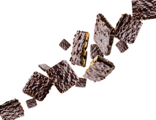 Cookies coated with chocolate and nuts fly in space forming the shape of a chain. Surround light from behind. Isolated on white.