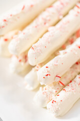 Candy cane chocolate covered pretzel rods