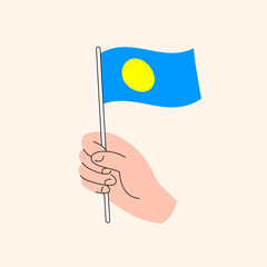 Cartoon Hand Holding Palauan Flag, Simple Vector Design. Flag of Palau, Oceania, Concept Illustration, Isolated Flat Drawing