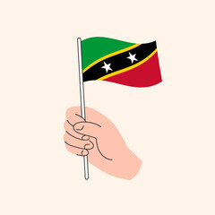 Flag of St Kitts, Caribbean, Concept Illustration, Isolated Flat Drawing. Cartoon Hand Holding Saint Kitts and Nevis Flag, Simple Vector Design. 
