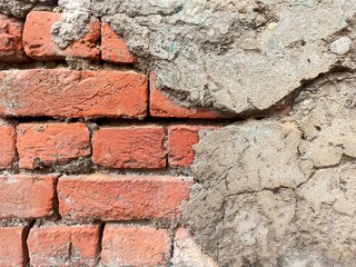 Damaged plaster brick wall