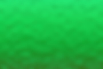 Abstract blurred background image of green colors gradient used as an illustration. Designing posters or advertisements.