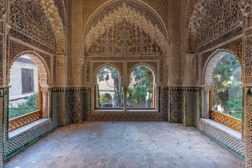Daxara viewpoint with pointed arch of muqarnas and ceramics in the Alhambra of Granda, Spain.