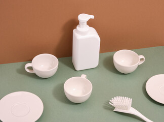 White gel dispenser to wash dirty dishes and clean dishes. White cleaning brush.