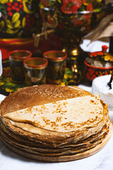 Pancakes with honey on the table in the Ukrainian  or Russian style