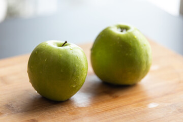 Fresh Organic Green Apple with Water Drops on Wooden Board - Crisp and Juicy Delight