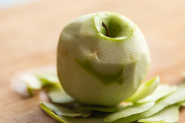Fresh Organic Peeled Green Apple with Water Drops on Wooden Board - Crisp and Refreshing Delight